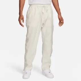 Sure! Here’s an optimized title for the product:

Nike Devin Booker Tear-Away Pants in Pale Ivory - Stylish & Functional Athleisure Wear